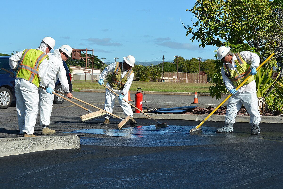 B&R Solutions Team applying sealcoat
